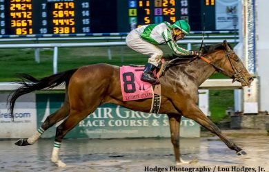 Guest Suite with jockey Robby Albarado aboard captures the 73rd Lecomte Stakes at Fair Grounds (photo by Lou Hodges / Hodges Photography).