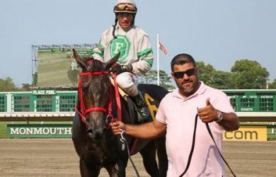 Jorge Navarro leads a horse into the winner's circle at Monmouth Park - Phote courtsy of Bill Denver - Equi-Photo/ BloodHorse
